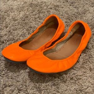 Orange Tieks size 8